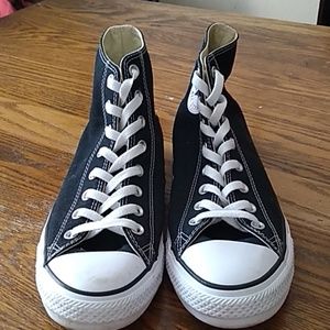 Chuck Taylor converse black high tops.